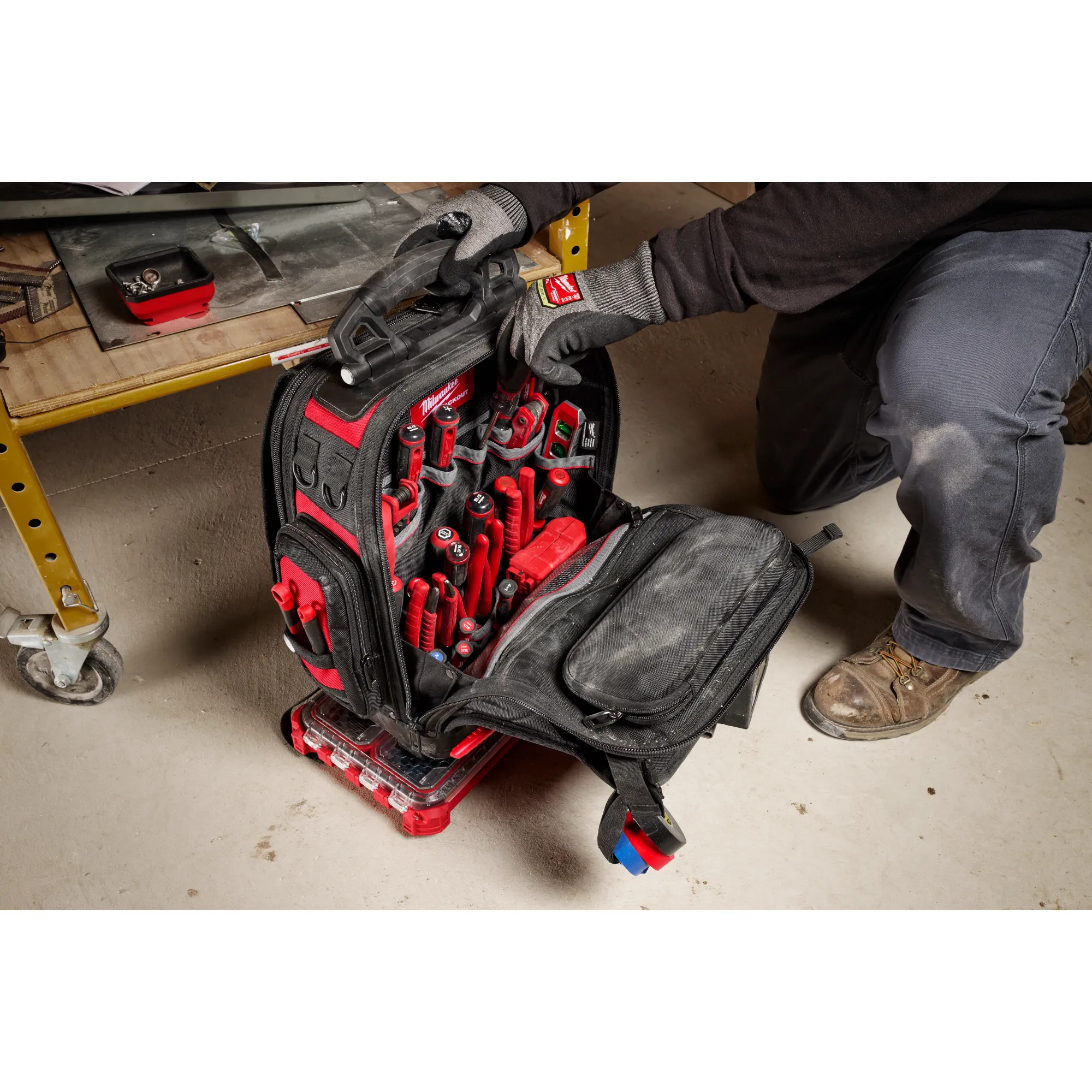 Image of the PACKOUT Rolling Toolbox being used by a worker on a jobsite