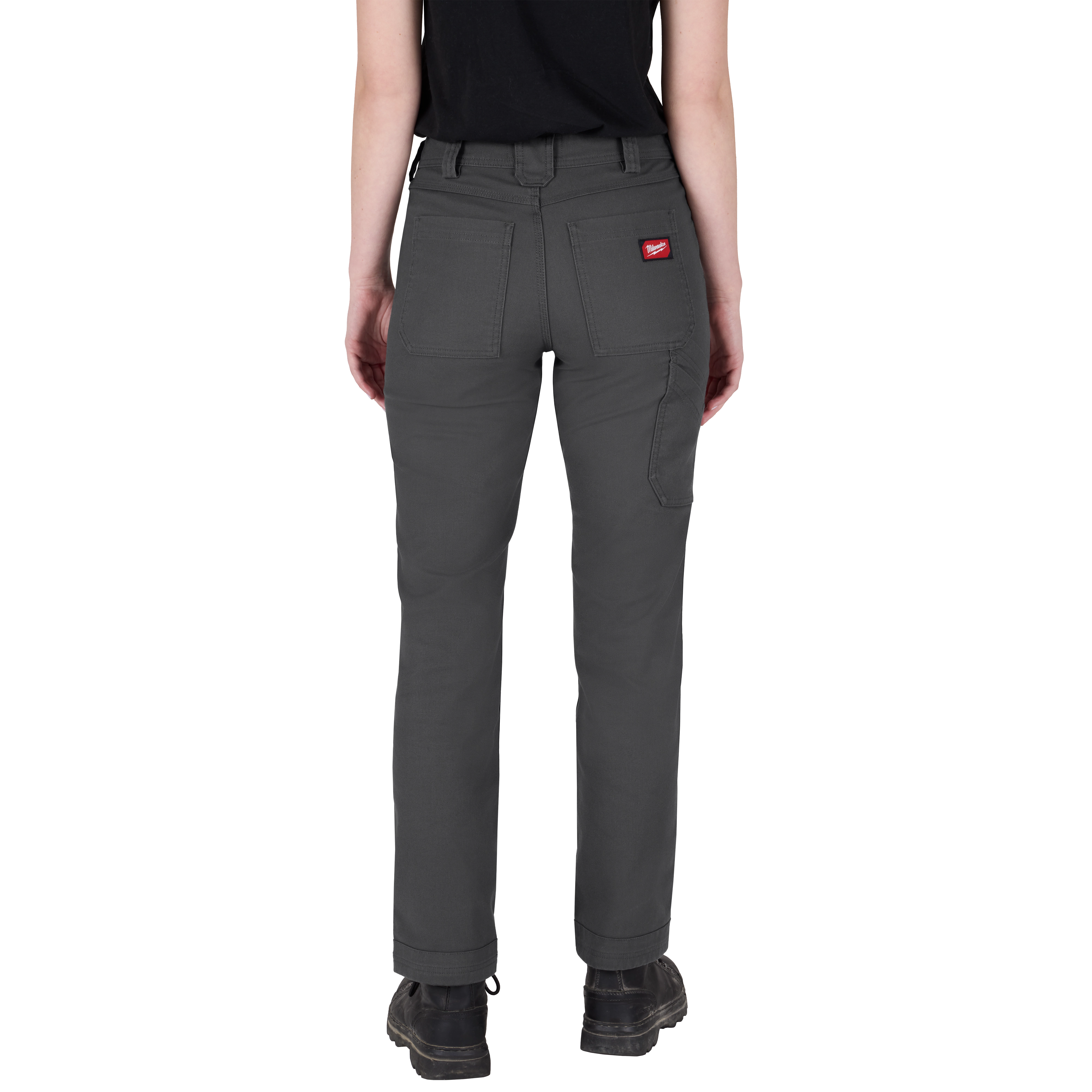 A person wearing gray Women's Work Pants with multiple pockets and a red logo on the back pocket. The person is seen from the back, showing the pants' fit. The image is titled "Women's Work Pants - Gray."